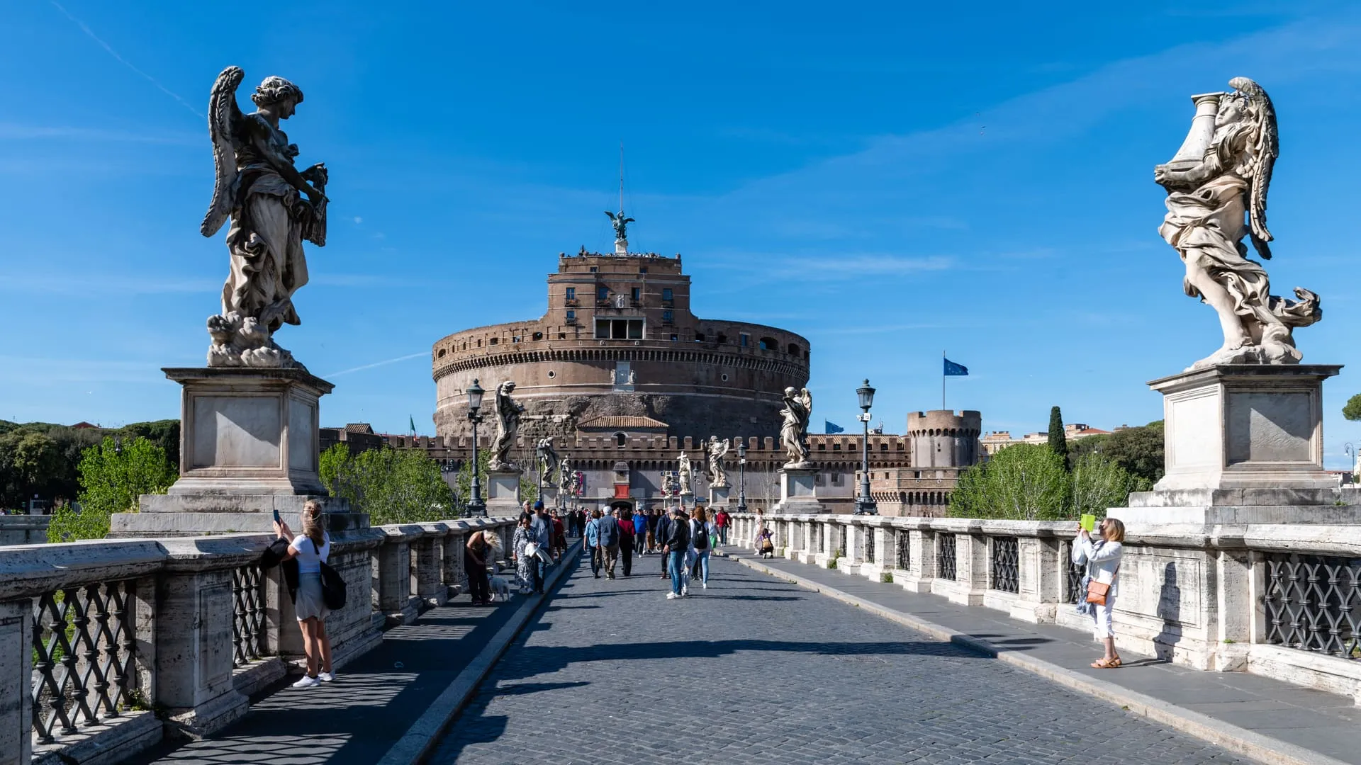 Castel Sant'Angelo seen across the Tiber, with Ponte Sant'Angelo in the foreground.